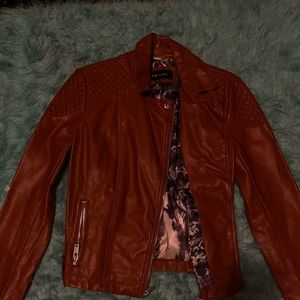 Leather jacket with snake skin inside.